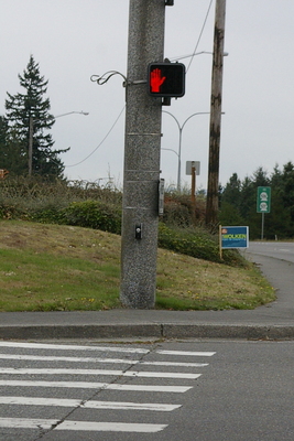 Wheelchair Barrier 2:  This intersection has no "sloped curb," therefore anyone using a wheelchair cannot get from the street level to the sidewalk level.