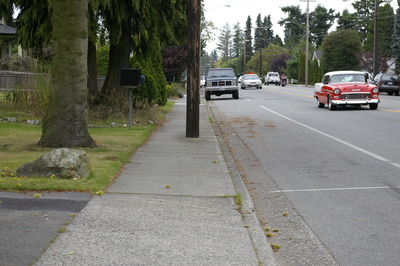 Wheelchair Barrier 1:  A telephone pole occurs every 100 feet in the middle of sidewalk in Gamma's neighborhood, preventing those using wheelchairs from passing.